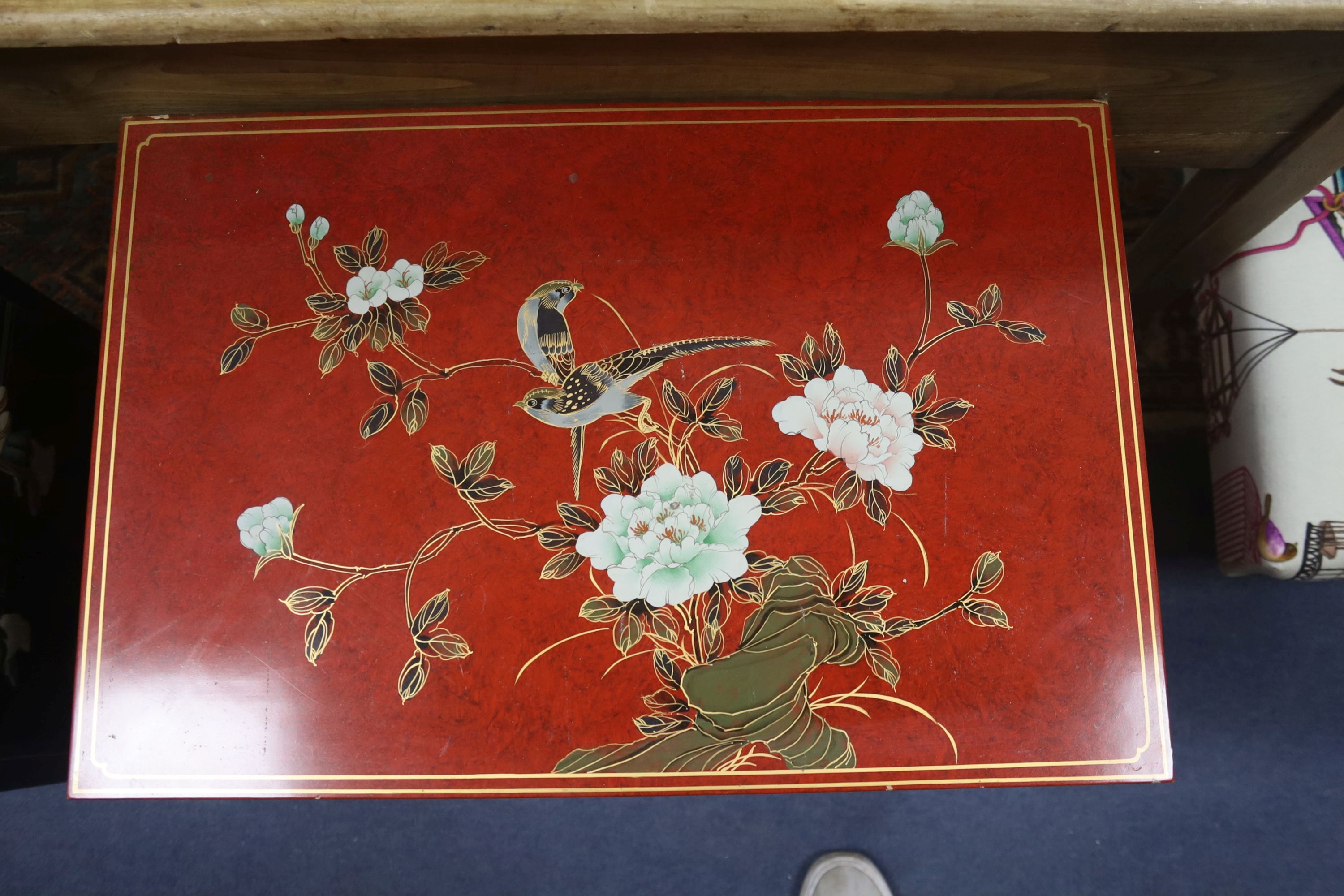A Chinese black laquer chest of five drawers, a red lacquer chest and a cream lacquer coffee table